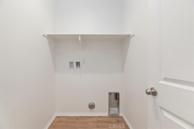 467 Daniella Way, Perris, CA 92570 - laundry room with hookup for a washing machine, wood finished floors, and baseboards
