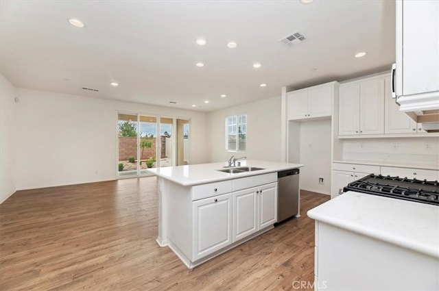 467 Daniella Way, Perris, CA 92570 - kitchen featuring stainless steel dishwasher, a sink, white cabinets, recessed lighting, and light countertops