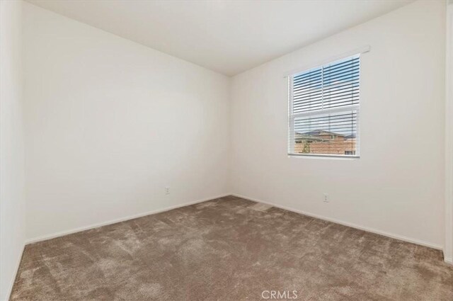 467 Daniella Way, Perris, CA 92570 - spare room featuring carpet flooring and baseboards