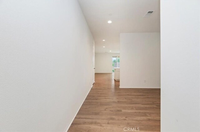 467 Daniella Way, Perris, CA 92570 - hall featuring recessed lighting, light wood-type flooring, and baseboards