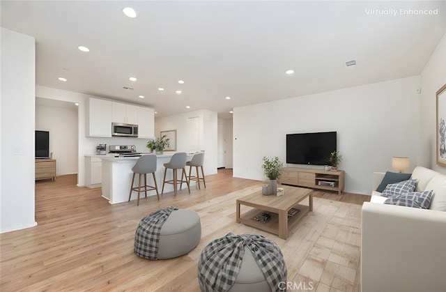 467 Daniella Way, Perris, CA 92570 - living room with recessed lighting and light wood-type flooring