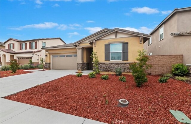 467 Daniella Way, Perris, CA 92570 - view of front facade featuring stone siding, stucco siding, driveway, and an attached garage