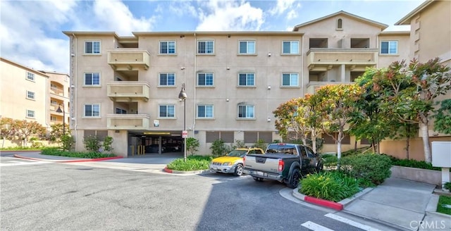 1437 Lomita Blvd Unit 227, Harbor City, CA 90710 - view of building exterior featuring uncovered parking