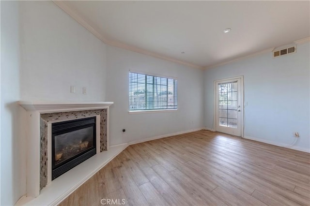 1437 Lomita Blvd Unit 227, Harbor City, CA 90710 - unfurnished living room featuring a glass covered fireplace, ornamental molding, wood finished floors, and visible vents