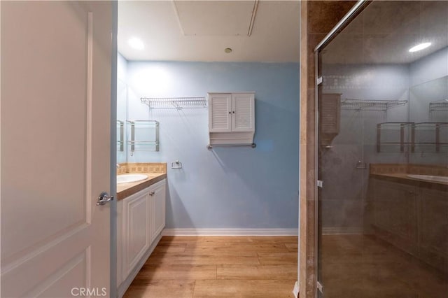 1437 Lomita Blvd Unit 227, Harbor City, CA 90710 - bathroom with vanity, a shower with door, wood finished floors, baseboards, and a spacious closet
