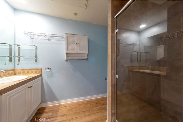 1437 Lomita Blvd Unit 227, Harbor City, CA 90710 - bathroom featuring baseboards, a tile shower, wood finished floors, and vanity