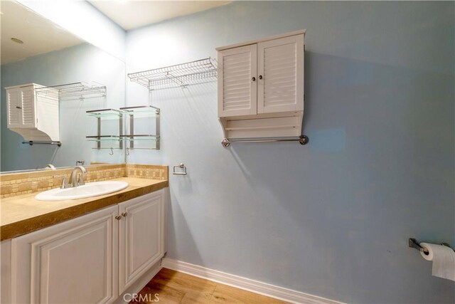 1437 Lomita Blvd Unit 227, Harbor City, CA 90710 - bathroom with baseboards, vanity, and wood finished floors