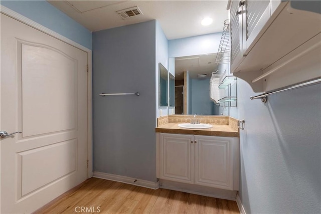 1437 Lomita Blvd Unit 227, Harbor City, CA 90710 - bathroom with baseboards, visible vents, wood finished floors, and vanity