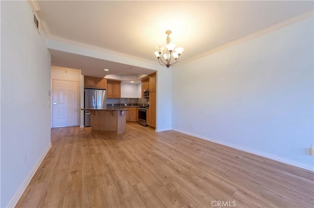 1437 Lomita Blvd Unit 227, Harbor City, CA 90710 - kitchen featuring appliances with stainless steel finishes, tasteful backsplash, a notable chandelier, light wood-type flooring, and open floor plan