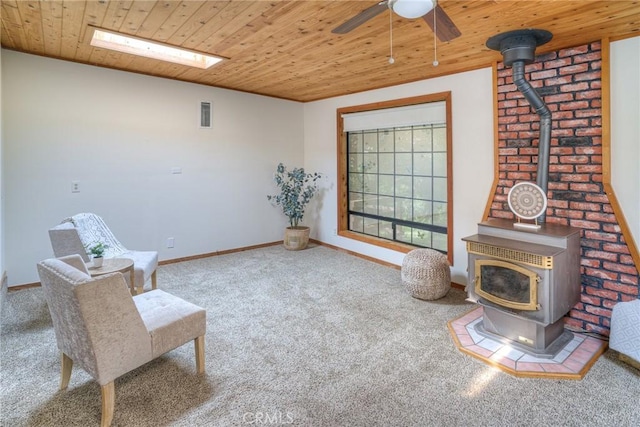 12 Linda Loma Dr, Oroville, CA 95966 - sitting room featuring a wood stove, ceiling fan, carpet floors, and wood ceiling