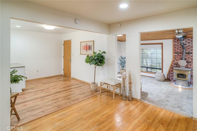 12 Linda Loma Dr, Oroville, CA 95966 - sitting room with baseboards, a wood stove, wood finished floors, and recessed lighting