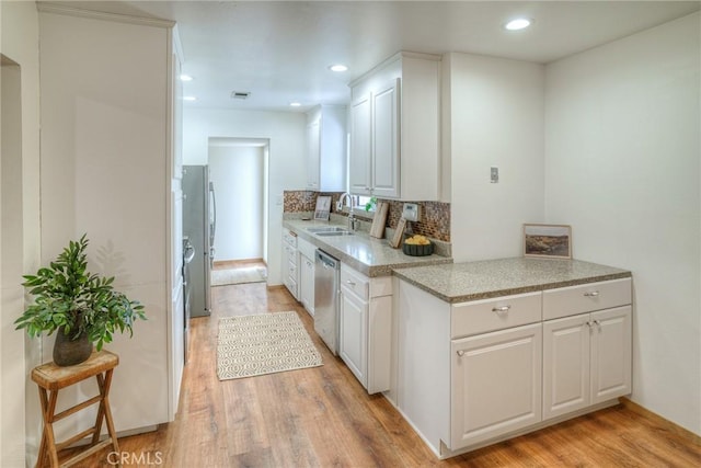 12 Linda Loma Dr, Oroville, CA 95966 - kitchen with a sink, dishwasher, white cabinets, and light wood-style floors