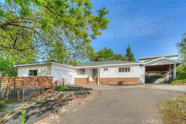 12 Linda Loma Dr, Oroville, CA 95966 - ranch-style house featuring a garage, brick siding, and driveway