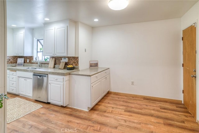 12 Linda Loma Dr, Oroville, CA 95966 - kitchen featuring stainless steel dishwasher, white cabinets, a sink, light wood-style floors, and backsplash