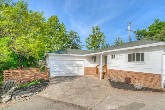 12 Linda Loma Dr, Oroville, CA 95966 - single story home with a garage, brick siding, and driveway