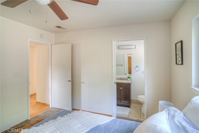 12 Linda Loma Dr, Oroville, CA 95966 - bedroom featuring visible vents, a ceiling fan, ensuite bath, and a sink