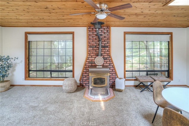 12 Linda Loma Dr, Oroville, CA 95966 - living room with a wood stove, a ceiling fan, carpet flooring, and wood ceiling