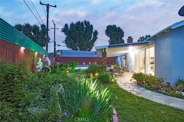 view of yard with a patio area and a fenced backyard