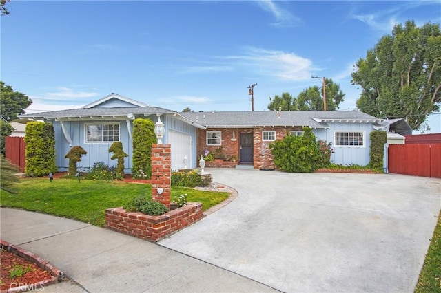 ranch-style house featuring a front yard, driveway, board and batten siding, an attached garage, and fence