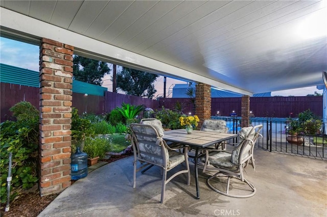 view of patio featuring outdoor dining space and a fenced backyard