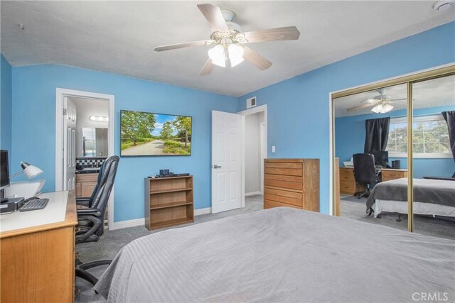 carpeted bedroom with a closet, a ceiling fan, visible vents, and baseboards