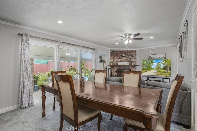 dining room featuring recessed lighting, a fireplace, a ceiling fan, visible vents, and light colored carpet