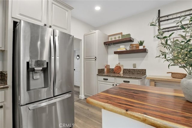 4338 Beagle St, Los Angeles, CA 90032 - kitchen with stainless steel refrigerator with ice dispenser, wood counters, white cabinetry, and recessed lighting