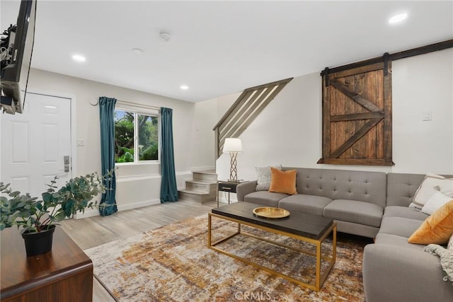 4338 Beagle St, Los Angeles, CA 90032 - living area with stairs, light wood finished floors, recessed lighting, baseboards, and a barn door