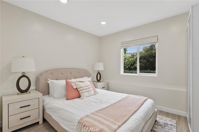 4338 Beagle St, Los Angeles, CA 90032 - bedroom with light wood finished floors, recessed lighting, and baseboards