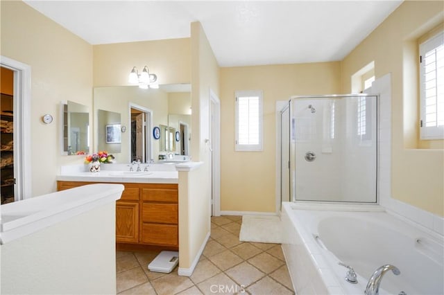 full bathroom with a bath, a shower stall, vanity, and plenty of natural light