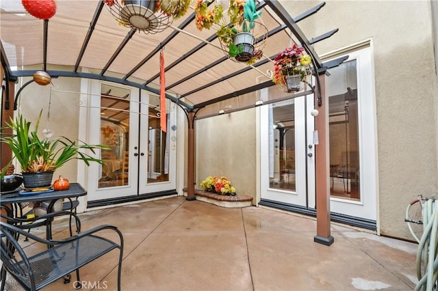 view of patio / terrace with a pergola and french doors