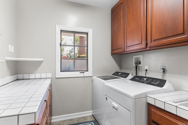 5135 Island Forest Pl, Westlake Village, CA 91362 - clothes washing area featuring cabinet space, baseboards, and washing machine and clothes dryer