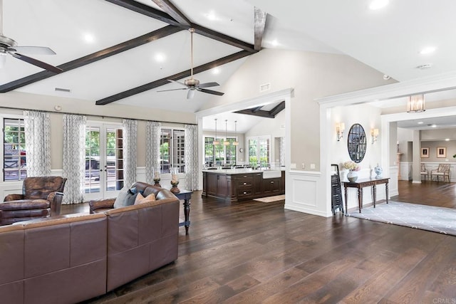 5135 Island Forest Pl, Westlake Village, CA 91362 - living room featuring dark wood-type flooring, lofted ceiling with beams, ceiling fan, and a decorative wall