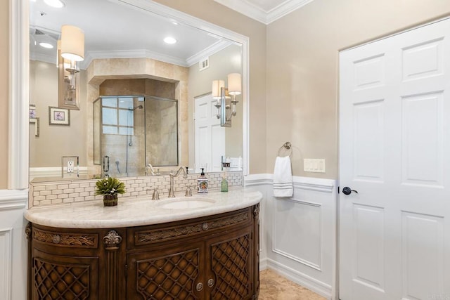 5135 Island Forest Pl, Westlake Village, CA 91362 - full bath with crown molding, decorative backsplash, vanity, a wainscoted wall, and a stall shower