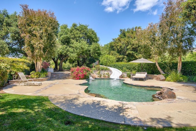 5135 Island Forest Pl, Westlake Village, CA 91362 - view of swimming pool with a fenced in pool, a water slide, and a patio