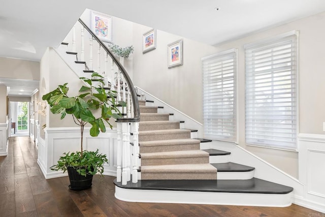 5135 Island Forest Pl, Westlake Village, CA 91362 - staircase featuring a decorative wall, wood-type flooring, and wainscoting