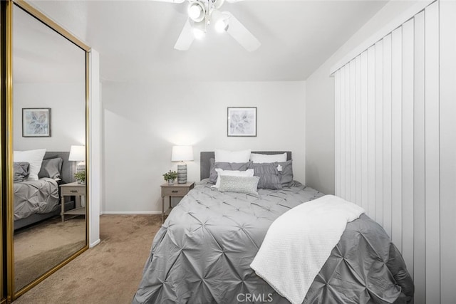 carpeted bedroom with a ceiling fan
