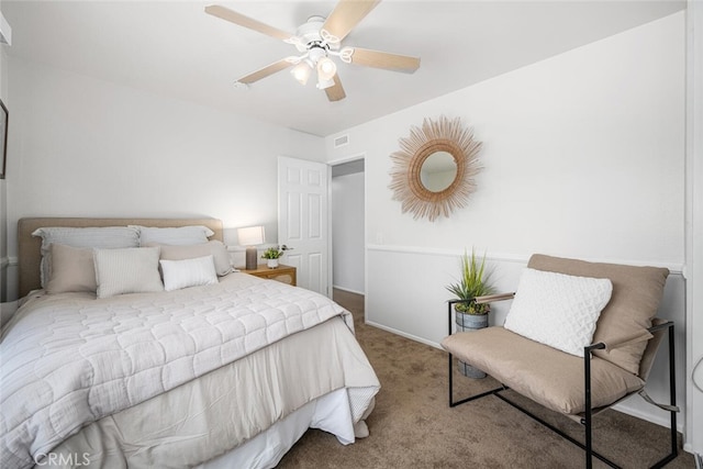 bedroom with carpet floors, baseboards, ceiling fan, and visible vents
