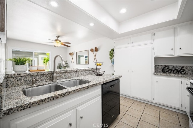 kitchen with ceiling fan, light stone countertops, dishwasher, a sink, and white cabinetry