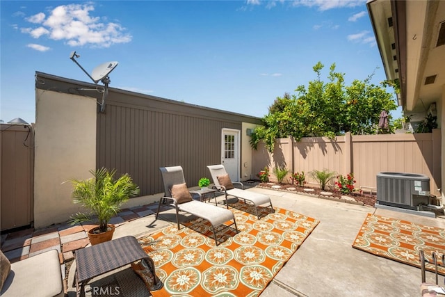 view of patio / terrace with fence and cooling unit