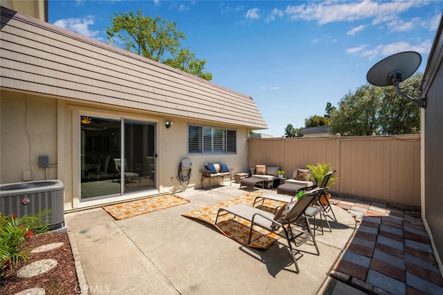 view of patio / terrace featuring an outdoor living space, a fenced backyard, and central air condition unit