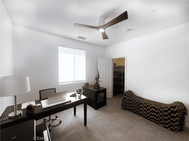 office featuring visible vents, light tile patterned floors, and a ceiling fan