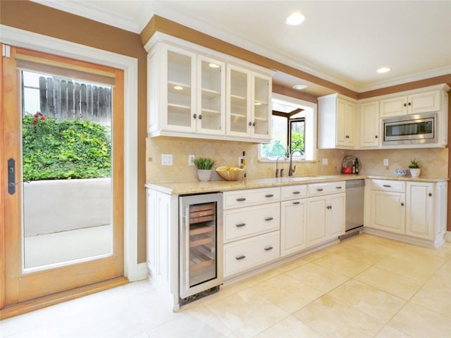 4911 Browndeer Ln, Rancho Palos Verdes, CA 90275 - kitchen featuring beverage cooler, stainless steel appliances, a sink, backsplash, and ornamental molding