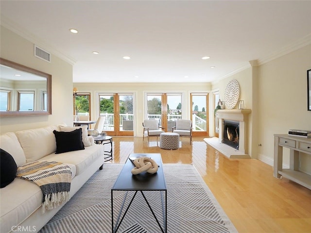4911 Browndeer Ln, Rancho Palos Verdes, CA 90275 - living area featuring light wood-type flooring, ornamental molding, a lit fireplace, recessed lighting, and baseboards
