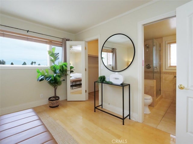 interior space with ornamental molding and wood finished floors