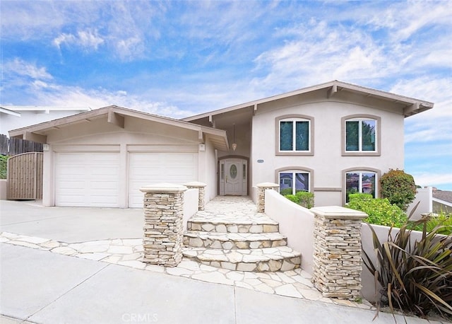 4911 Browndeer Ln, Rancho Palos Verdes, CA 90275 - view of front of home featuring an attached garage, concrete driveway, and stucco siding