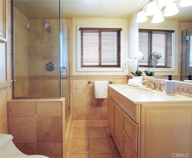 4911 Browndeer Ln, Rancho Palos Verdes, CA 90275 - bathroom with toilet, tile walls, vanity, a shower stall, and a chandelier