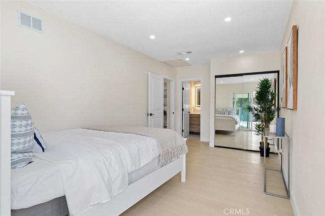 bedroom with recessed lighting, visible vents, and light wood finished floors