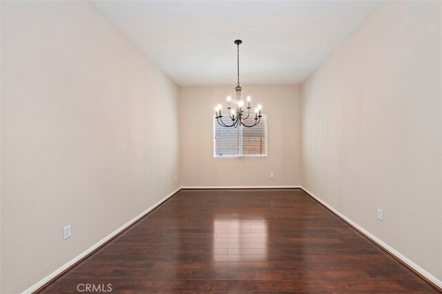 29855 Bay View Way, Menifee, CA 92584 - spare room with an inviting chandelier, wood finished floors, and baseboards