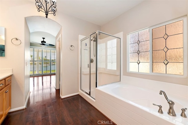 29855 Bay View Way, Menifee, CA 92584 - full bath featuring vanity, a bath, a stall shower, baseboards, and wood finished floors
